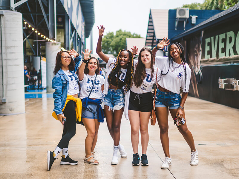 FIU Honors students doing Paws Up